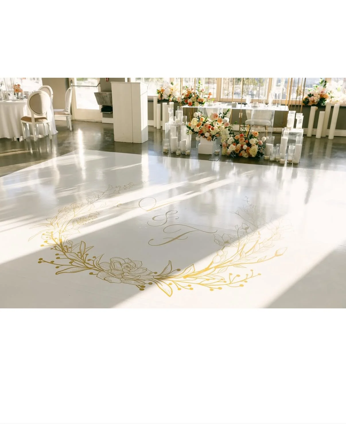Minimal white dance floor with a gold monogram