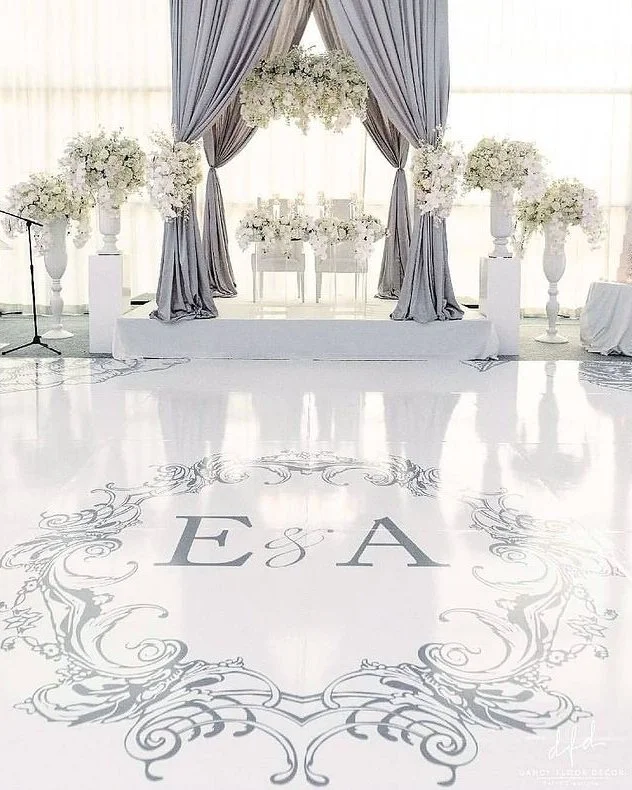Draped reception with a custom dance floor