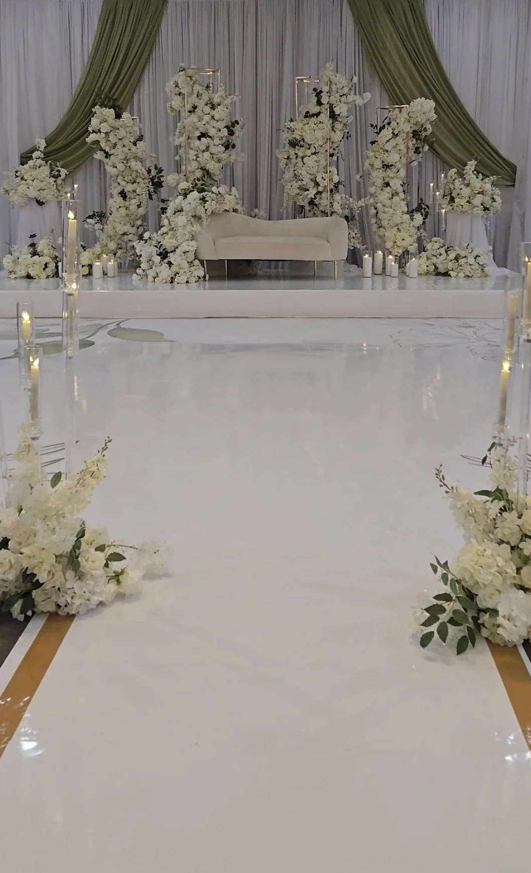 White floral backdrop with a custom dance floor